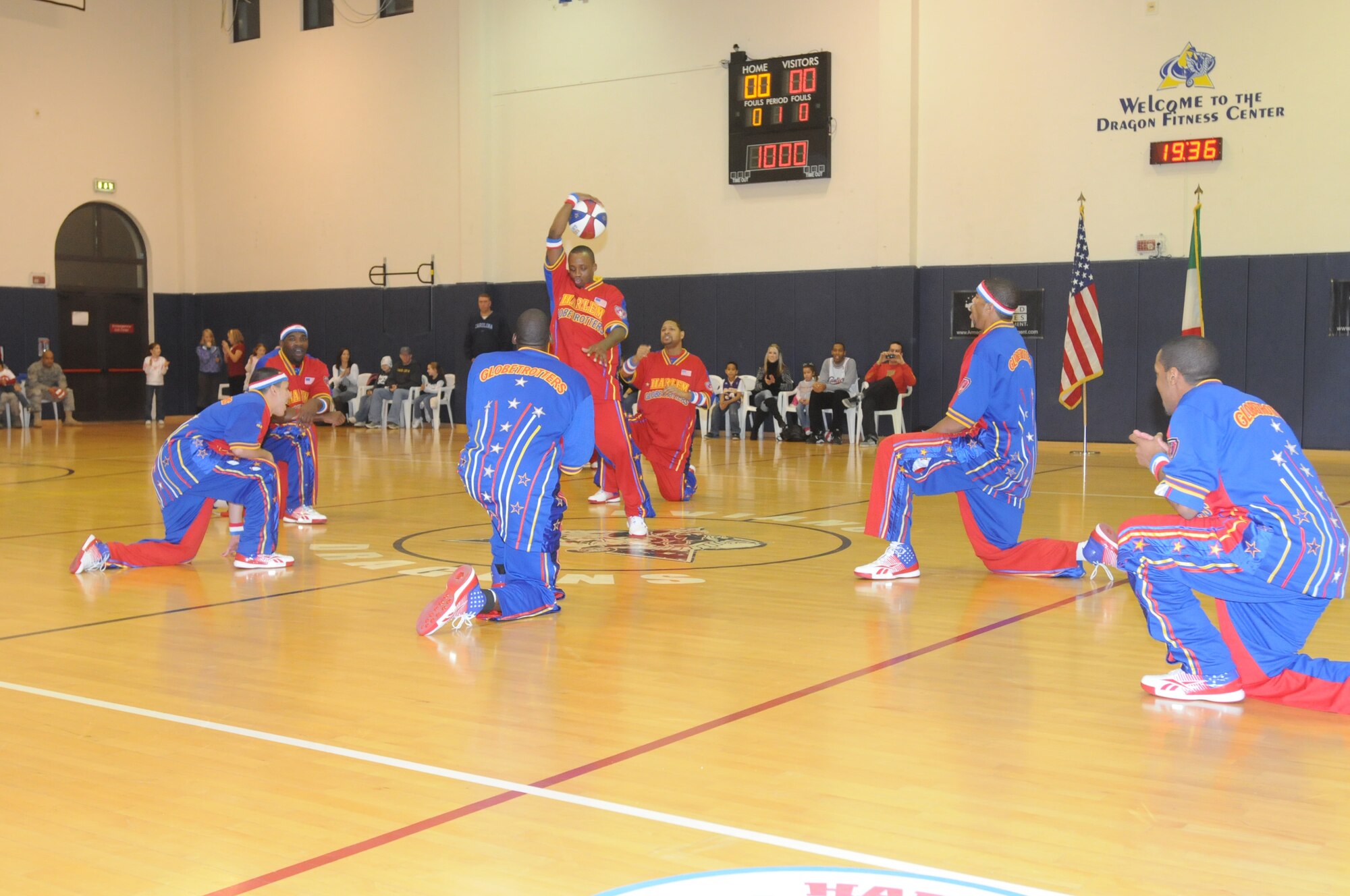 The Harlem Globetrotters perform their famous "Magic Circle" at the Dragon Fitness Center Dec. 2 before their exhibition game against the Washington Generals. The "Magic Circle" was created in 1942 and is a series of ball tricks performed by each player before any game played by the Globetrotters.(U.S. Air Force photo/Airman 1st Class LaVel Sterling)