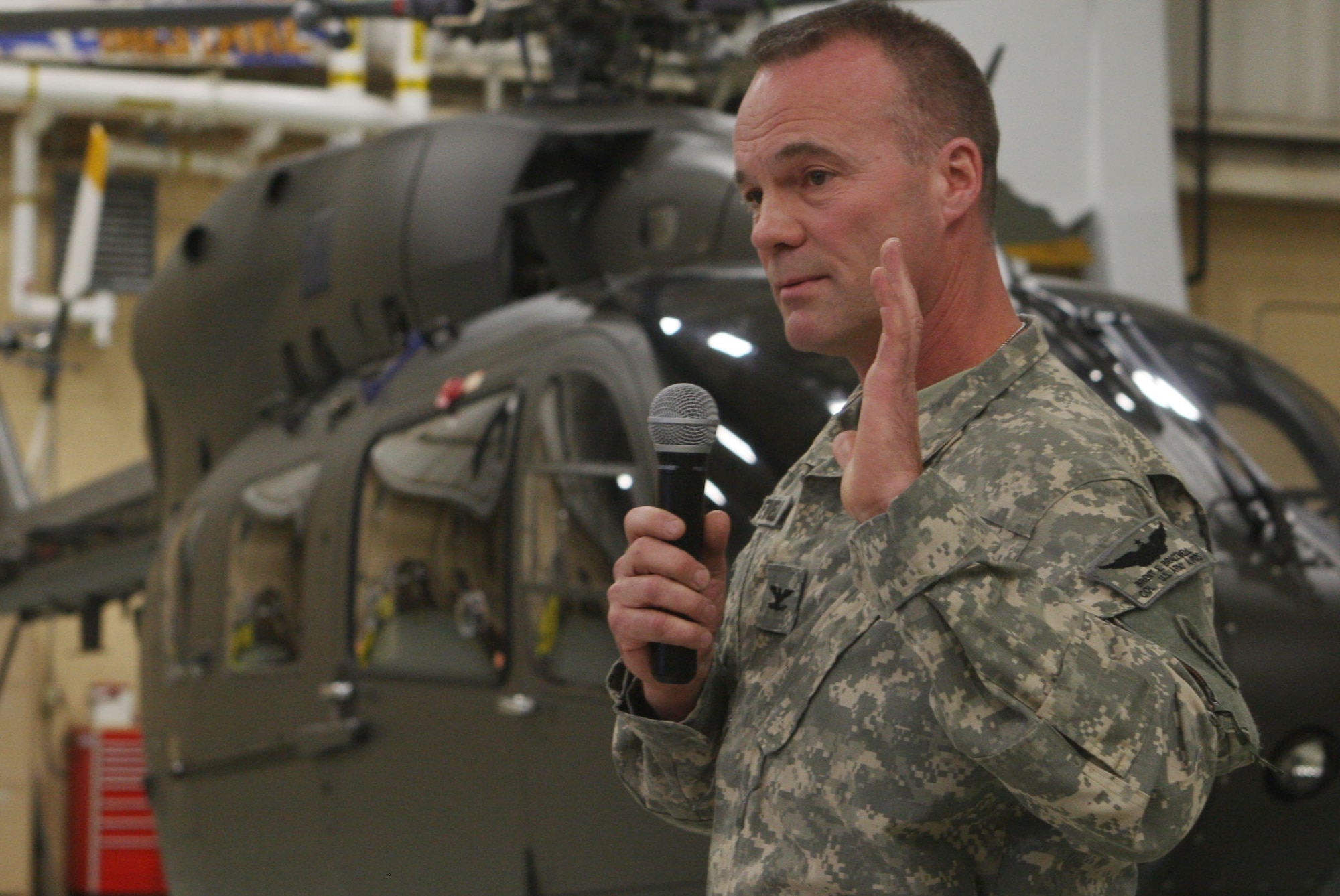 Col. Brent Bracewell, Commander of the 78th Aviation Troop Command, Georgia Army National Guard speaks to a crowd of military and civilian personnel during a UH-72A Lakota Helicopter Delivery Ceremony Dec 3. (U.S. Air Force Photo/Don Peek)
