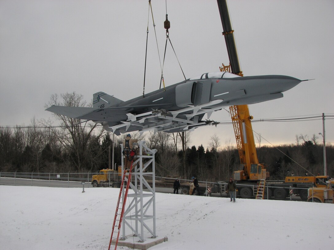 Workers craned a restored F-4 Phantom II jet onto its pedestal Friday afternoon at the Eastern Air Defense Sector in Rome, N.Y. One of the most renowned combat planes in the Air Force inventory, the F-4 was used extensively in Vietnam and saw service in Desert Storm before being retired in 1996. 