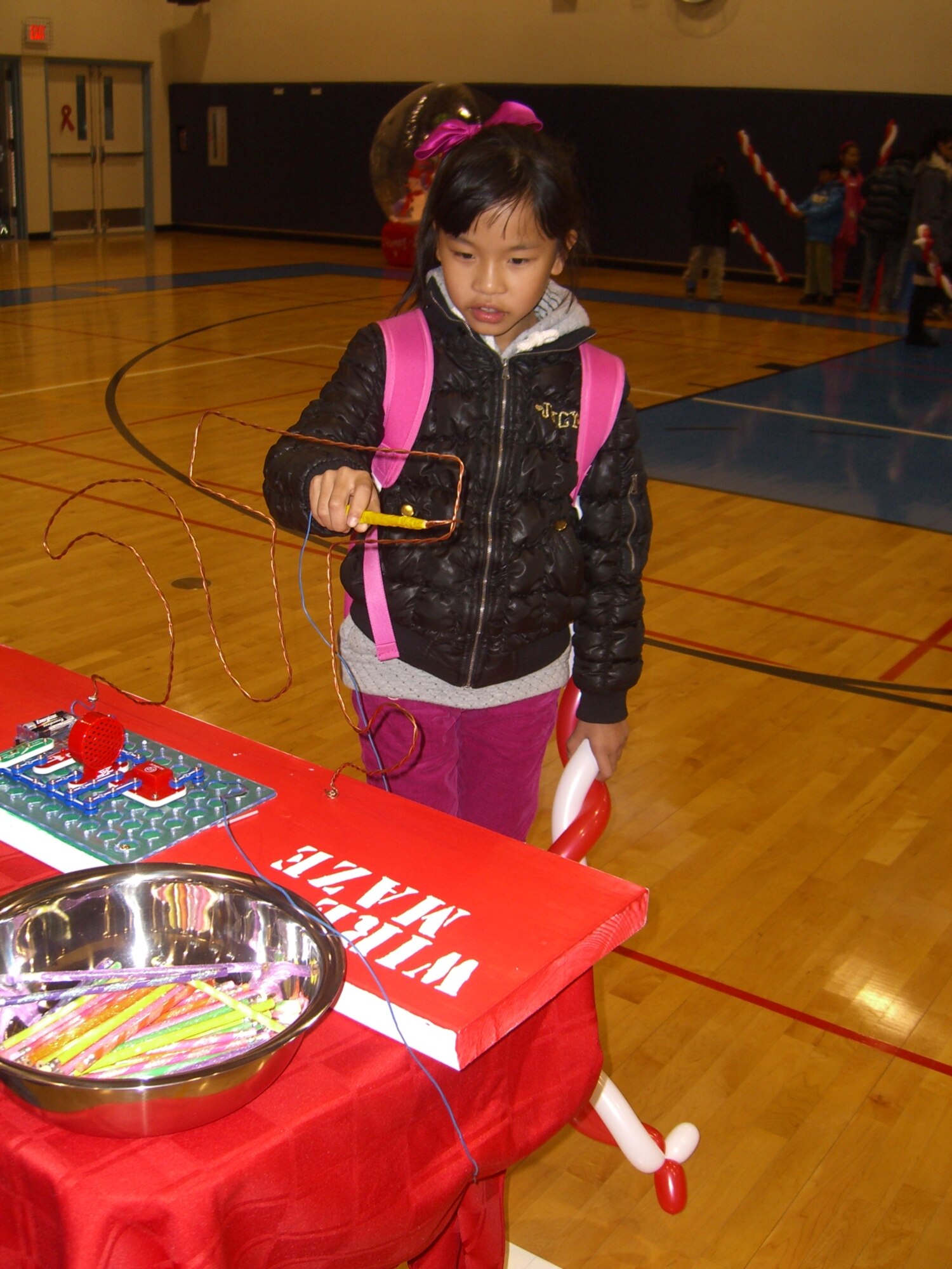 Children participate in games during the Pearl S. Buck Christmas Party at Osan Dec. 4. (Courtesy photo)