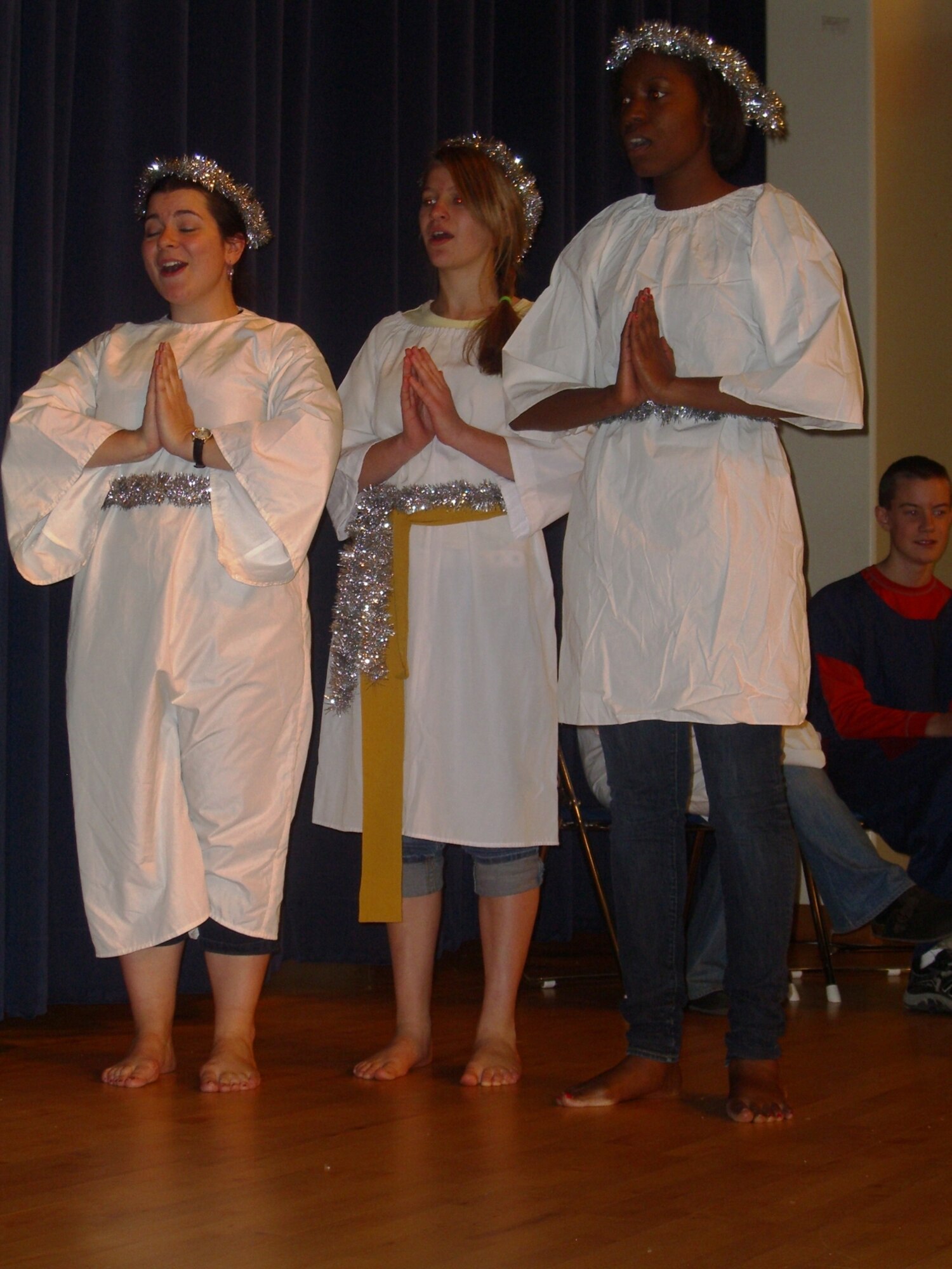Members of the Protestant Youth of the Chapel perform a short play during the Pearl S. Buck Christmas Party at Osan Dec. 4. (Courtesy photo)
