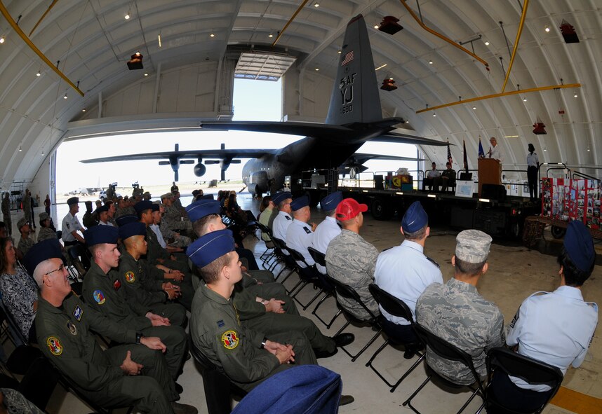 Airmen gather in Hangar 2 to watch the annual Operation Christmas Drop Push Ceremony at Andersen Air Force Base, Guam, Dec. 13. The ceremony marks the beginning of the humanitarian airlift operation which started 58 years ago, as a WB-50 aircrew returning to Guam on its final flight before Christmas, has turned into the longest running humanitarian campaign in the history of the U.S. Air Force and the entire world. (U.S. Air Force photo Senior Airman Nichelle Anderson)