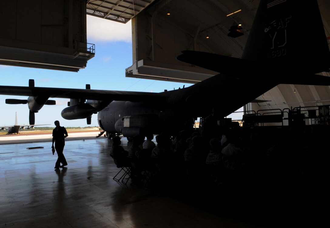 A U.S. Air Force C-130 Hercules sits in Hangar 2 during the Operation Christmas Drop Push Ceremony at Andersen Air Force Base, Guam, Dec. 13. Airmen from the Andersen and the 36th Airlift Squadron, Yokota Air Base, Japan, come together each year as part of a training exercise to drop thousands of pounds of donated supplies over the Micronesian Islands. To date, more than 800,000 pounds of supplies have been dropped to support the annual airlift operation. (U.S. Air Force photo/ Senior Airman Nichelle Anderson)