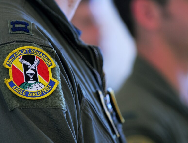 Aircrew stand in formation during Operation Christmas Drop push ceremony at Andersen Air Force Base, Guam, Dec. 13. The crew is from the 36th Airlift Squadron, Yokota Air Base, Japan. The ceremony officially marks the beginning of OCD 2010 with its first flight Dec. 13. This year Airmen will push 60 boxes to 60 islands. OCD is the Air Force?s longest-running humanitarian operation which began in 1952. Airmen today continue the tradition delivering supplies to remote islands of the Commonwealth of the Northern Marianas Islands, Yap, Palau, Chuuk and Pohnpei. (U.S. Air Force photo/ Senior Airman Nichelle Anderson)
