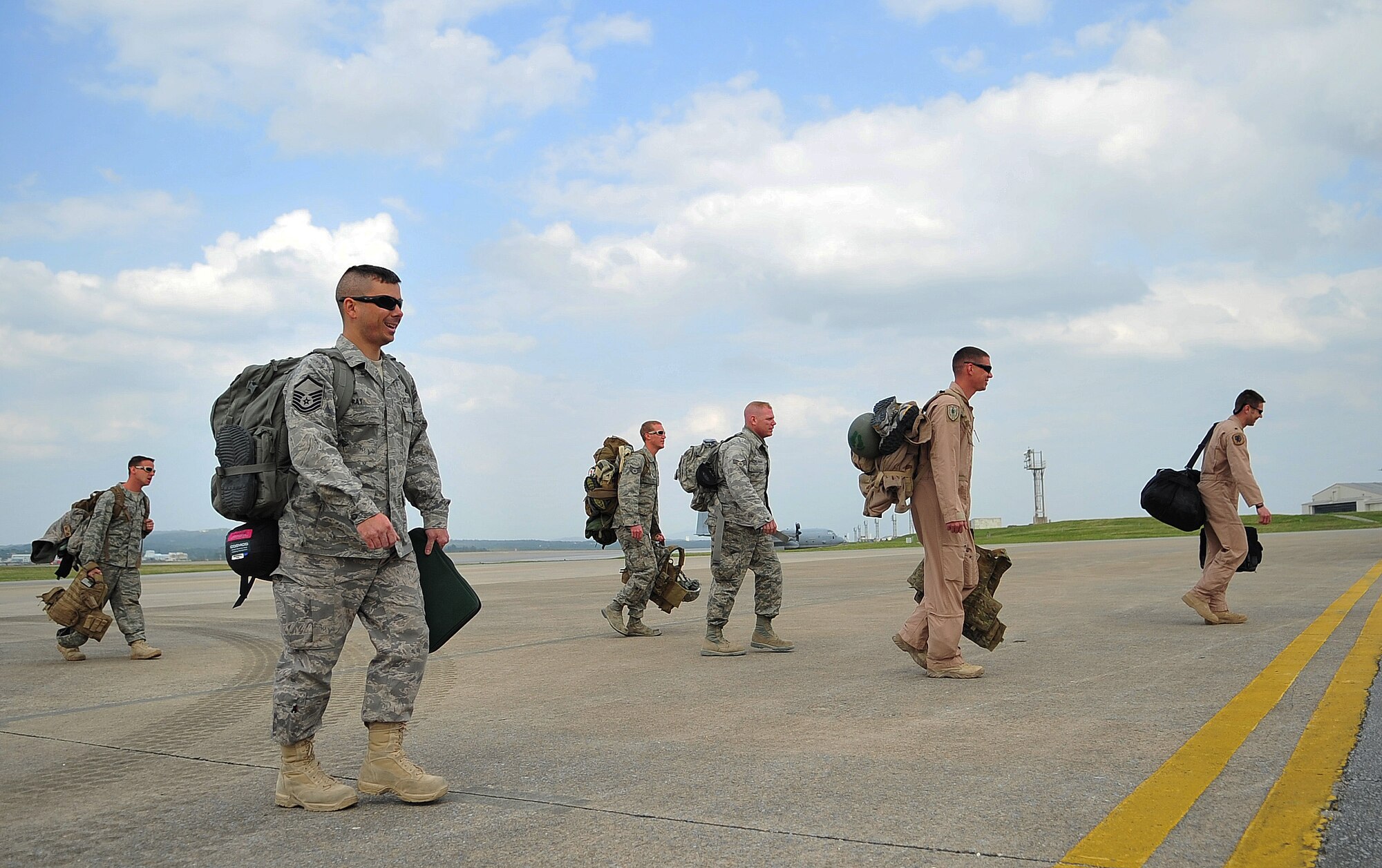 Airmen from the 33rd Rescue Squadron and 33rd Helicopter Maintenance Unit returned to Kadena Air Base, Dec. 9, after supporting Operation Enduring Freedom at Bagram Air Base, Afghanistan. The Airmen, who were deployed for three and a half months, were welcomed home by friends, family and base leadership. (U.S. Air Force photo/ Staff Sgt. Alesia D. Goosic)