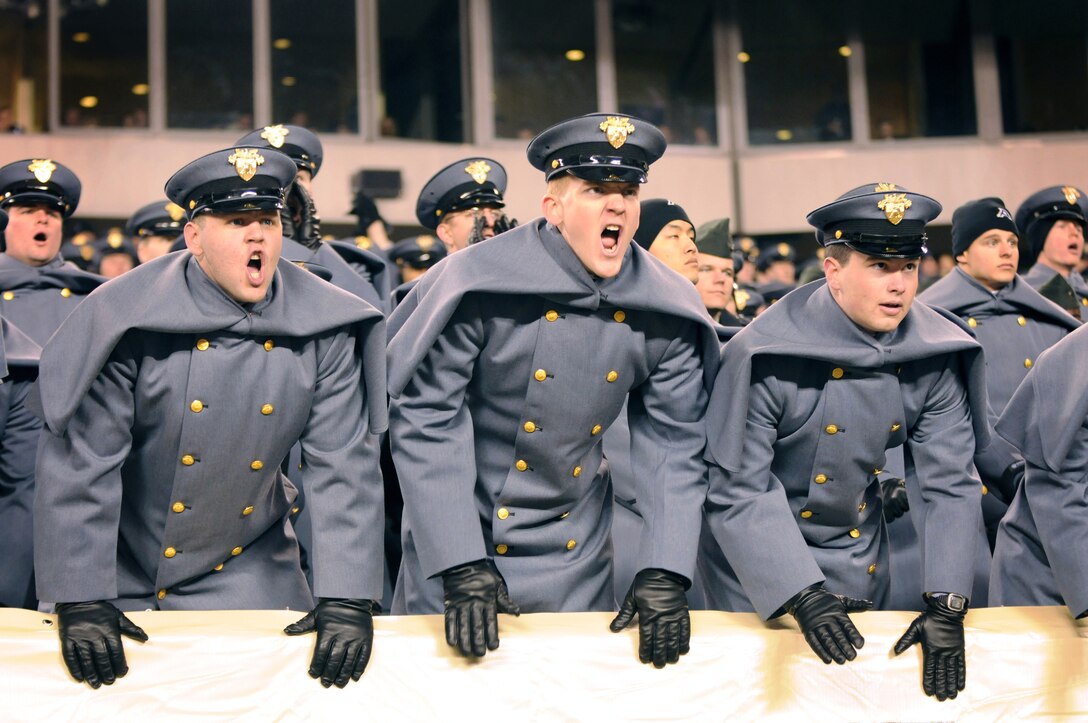 U.S. Military Academy cadets cheer for their Black Knights during the 111th Army-Navy game at Lincoln Financial Field in Philadelphia Dec. 11, 2010.