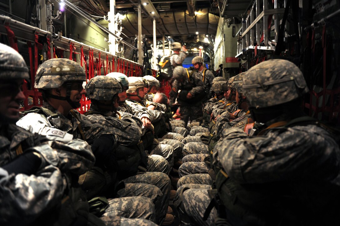 U.S. paratroopers wait to jump out of an Air Force C-130 aircraft over Sicily Drop Zone on Fort Bragg, N.C., Dec. 11, 2010.