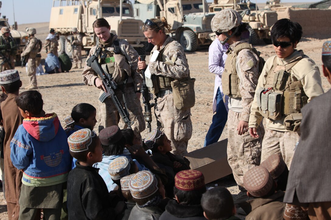 Members of the U.S. Marines' female engagement team teach a hygiene class to children during a village medical outreach in Boldak, Afghanistan, Nov. 22, 2010. 