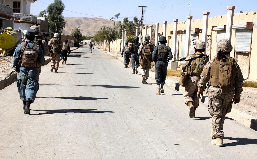 U.S. Marines return to Forward Operating Base Jackson during a patrol ...