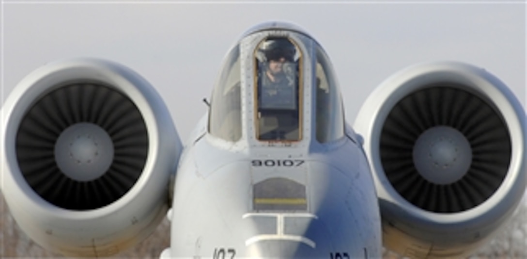 A pilot with the 442nd Fighter Wing sits on the ramp in his A-10 Thunderbolt II while crew chiefs perform a hot pit refuel for his aircraft at Whiteman Air Force Base, Mo., on Dec. 8, 2010.  Hot pit refueling is a procedure usually performed in a combat situation to rapidly refuel aircraft while engines are running to thrust pilots back into the fight.  The technicians with the 442nd Fighter Wing are practicing this procedure to keep their skills sharp.  