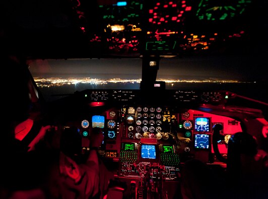 Lt. Col. Brian Hill, 96th Air Refueling Squadron commander (right), and Capt. Jasmine McCann, 96th ARS pilot, approach the Honolulu coastline in a KC-135 Stratotanker to land after completing the squadron's first operation al mission Dec. 14 at Joint Base Pearl Harbor-Hickam, Hawaii. During the mission, a 96th ARS KC-135 joined a KC-135 from the Iowa Air National Guard as part of a two-ship formation to refuel two B-52 Stratofortresses on the way to Guam. (U.S. Air Force photo/Staff Sgt. Nathan Allen)