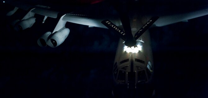 A B-52 Stratofortress is refueled by a KC-135 Stratotanker manned by members of the 96th and 203rd Air Refueling Squadrons over the Pacific Ocean Dec. 14 as part of the 96th ARS's first operational mission. During the mission, a 96th ARS KC-135 joined a KC-135 from the Iowa Air National Guard as part of a two-ship formation to refuel two B-52 Stratofortresses on the way to Guam. (U.S. Air Force photo/Staff Sgt. Nathan Allen)