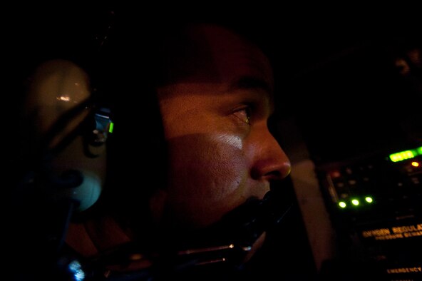 Tech. Sgt. Derek Wheeler, 203rd Air Refueling Squadron boom operator of the Hawaii Air National Guard, teamed with 96th ARS aircrew members to conduct the squadron's first operational mission Dec. 14 at Joint Base Pearl Harbor-Hickam, Hawaii. During the mission, a 96th ARS KC-135 Stratotanker joined a KC-135 from the Iowa ANG as part of a two-ship formation to refuel two B-52 Stratofortresses on the way to Guam. (U.S. Air Force photo/Staff Sgt. Nathan Allen)