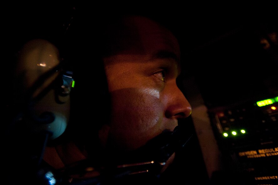 Tech. Sgt. Derek Wheeler, 203rd Air Refueling Squadron boom operator of the Hawaii Air National Guard, teamed with 96th ARS aircrew members to conduct the squadron's first operational mission Dec. 14 at Joint Base Pearl Harbor-Hickam, Hawaii. During the mission, a 96th ARS KC-135 Stratotanker joined a KC-135 from the Iowa ANG as part of a two-ship formation to refuel two B-52 Stratofortresses on the way to Guam. (U.S. Air Force photo/Staff Sgt. Nathan Allen)