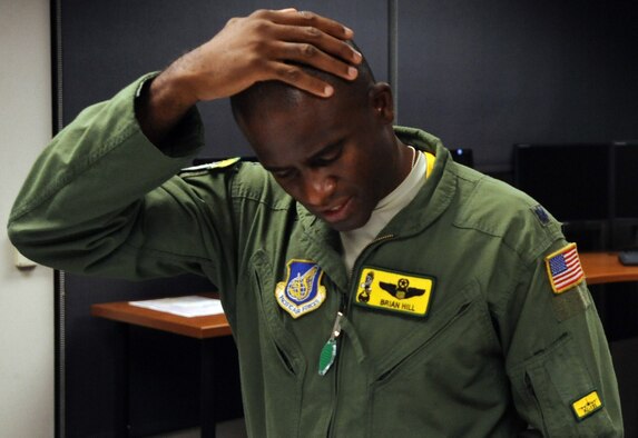 Lt. Col. Brian Hill, 96th Air Refueling Squadron commander and aircraft commander for the squadron's first operational refueling mission, reviews pre-flight planning documents Dec. 14 at Joint Base Pearl Harbor-Hickam, Hawaii. During the mission, a 96th ARS KC-135 Stratotanker joined a KC-135 from the Iowa Air National Guard as part of a two-ship formation to refuel two B-52 Stratofortresses on the way to Guam. (U.S. Air Force photo/Staff Sgt. Nathan Allen)