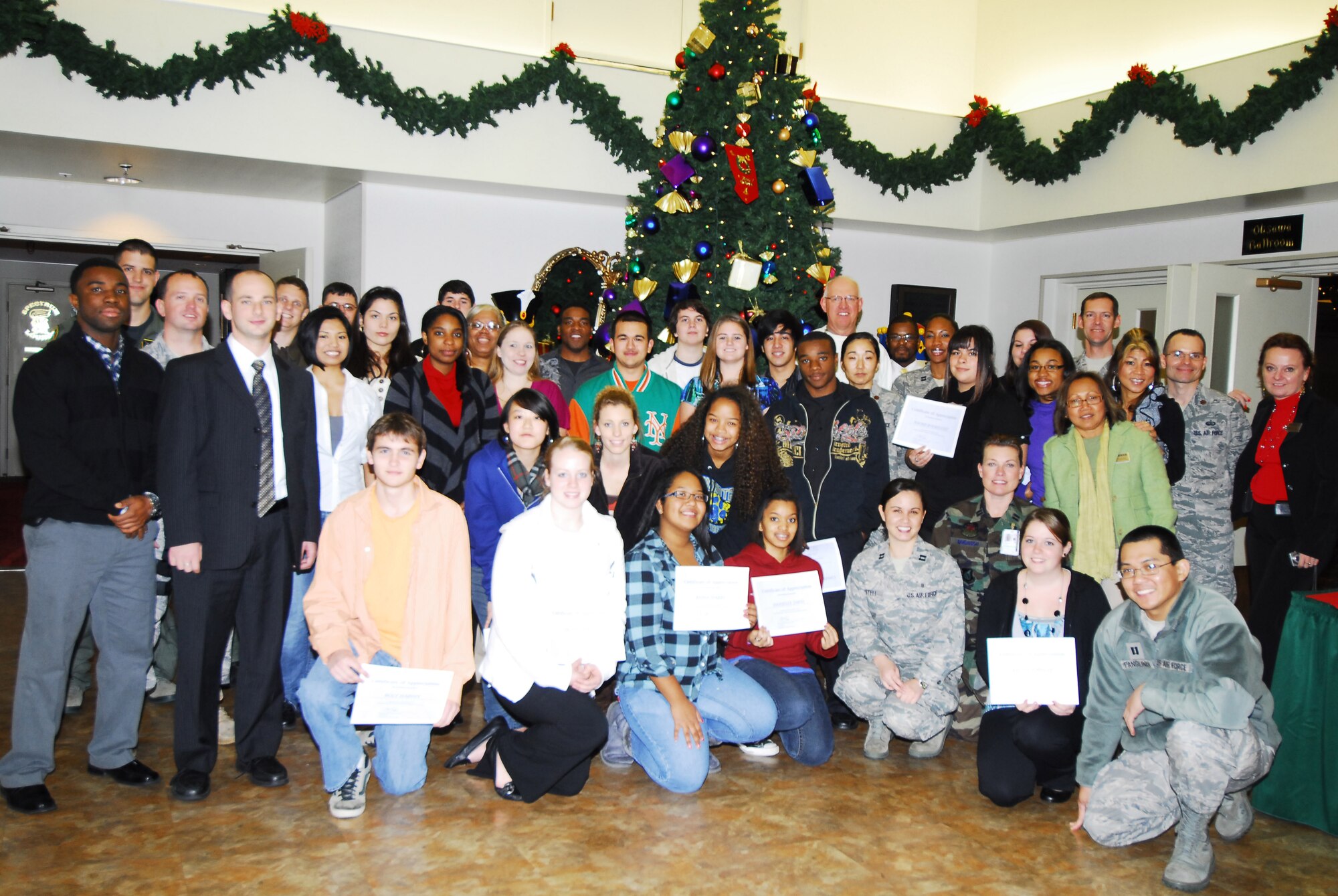YOKOTA AIR BASE, Japan -- Students of Yokota High School pose with their mentors at a job shadow luncheon here, Dec. 14. Students followed professionals in the job of their interest for 2.5 hours to get an idea of what the job is like. (U.S. Air Force photos/Airman 1st Class Lynsie Nichols)