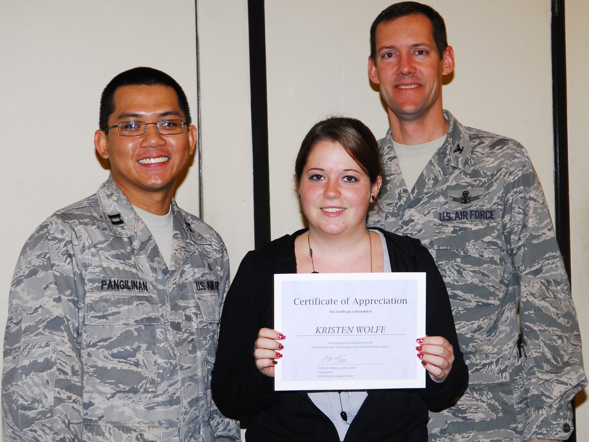 YOKOTA AIR BASE, Japan -- Kristen Wolfe, a student at Yokota High School, receives an award for completing a job shadow course during a luncheon here, Dec. 14. Students followed professionals in the job of their interest for 2.5 hours to get an idea of what the job is like. (U.S. Air Force photos/Airman 1st Class Lynsie Nichols)