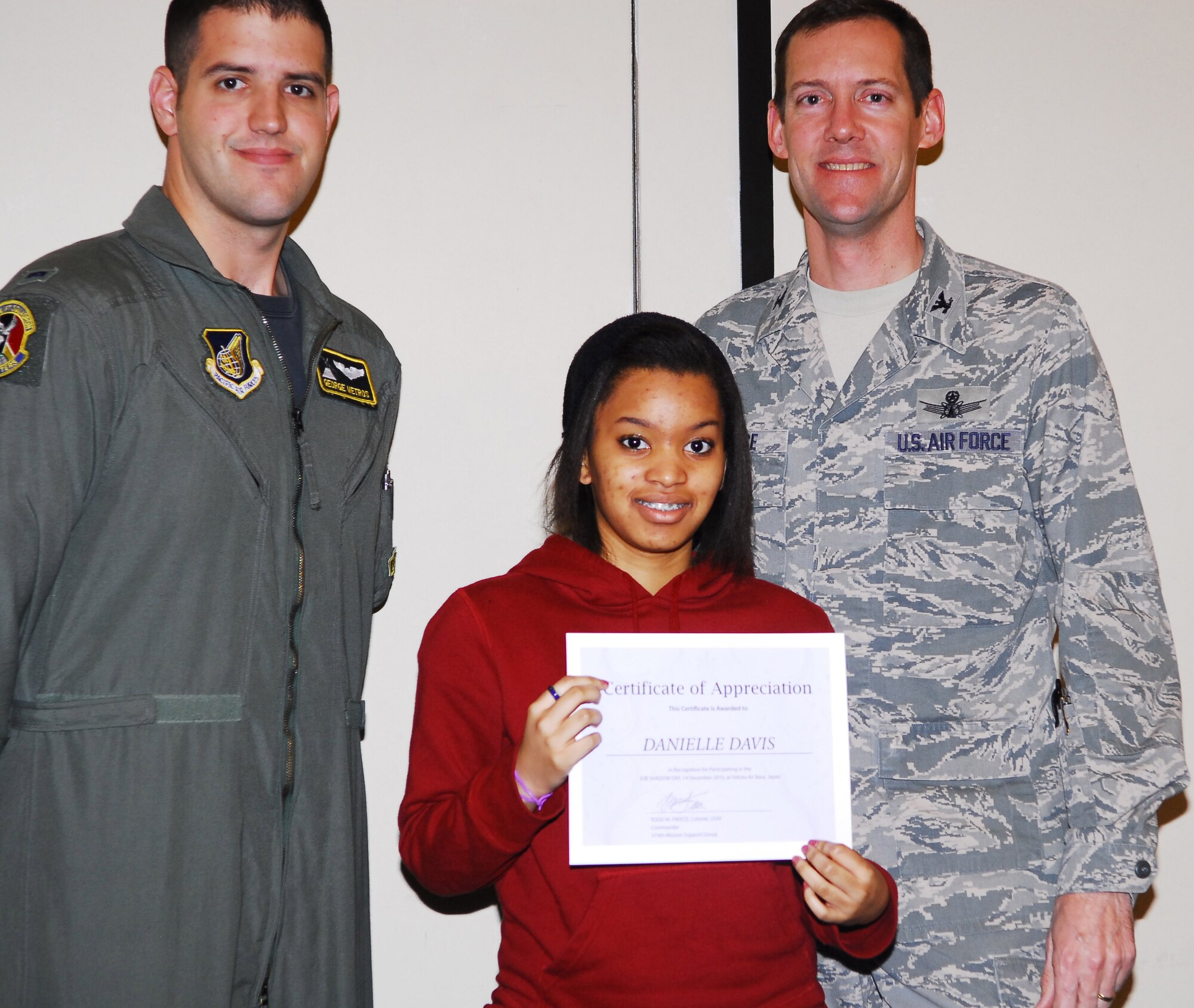 YOKOTA AIR BASE, Japan -- Danielle Davis, a student at Yokota High School, receives an award for completing a job shadow course during a luncheon here, Dec. 14. Students followed professionals in the job of their interest for 2.5 hours to get an idea of what the job is like. (U.S. Air Force photos/Airman 1st Class Lynsie Nichols)