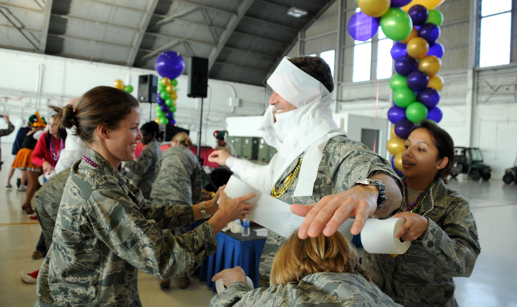 MacDill Air Force Base, Fla. -- As part of the holiday celebration, members of the 927th Air Refueling Wing made snowmen.  When no snow was available in Tampa, toilet paper sufficed.  Colonel Ted Mathews, vice wing commander, found himself looking like Frosty the Snowman by the end of the event. (Official United States Air Force photo by Staff Sgt. Shawn C. Rhodes)