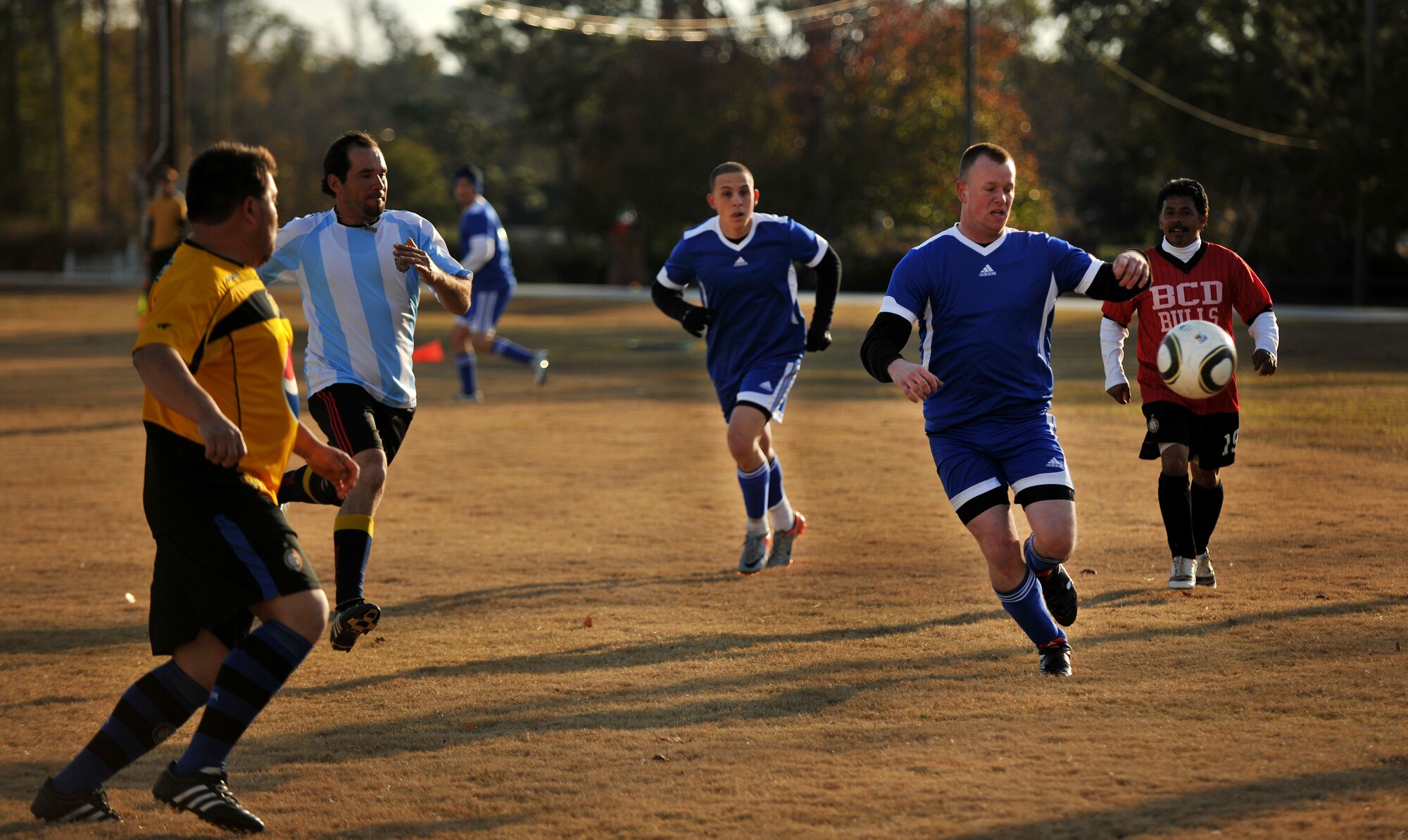 VALDOSTA, Ga.-- Edward Huffman from Moody Air Force Base, Ga. tries to get to the ball before a defender during a soccer match Dec. 12. Both teams played a very aggressive game but Moody came out on top, winning 4-1. (U.S. Air Force photo/Airman 1st Class Joshua Green)(RELEASED)
