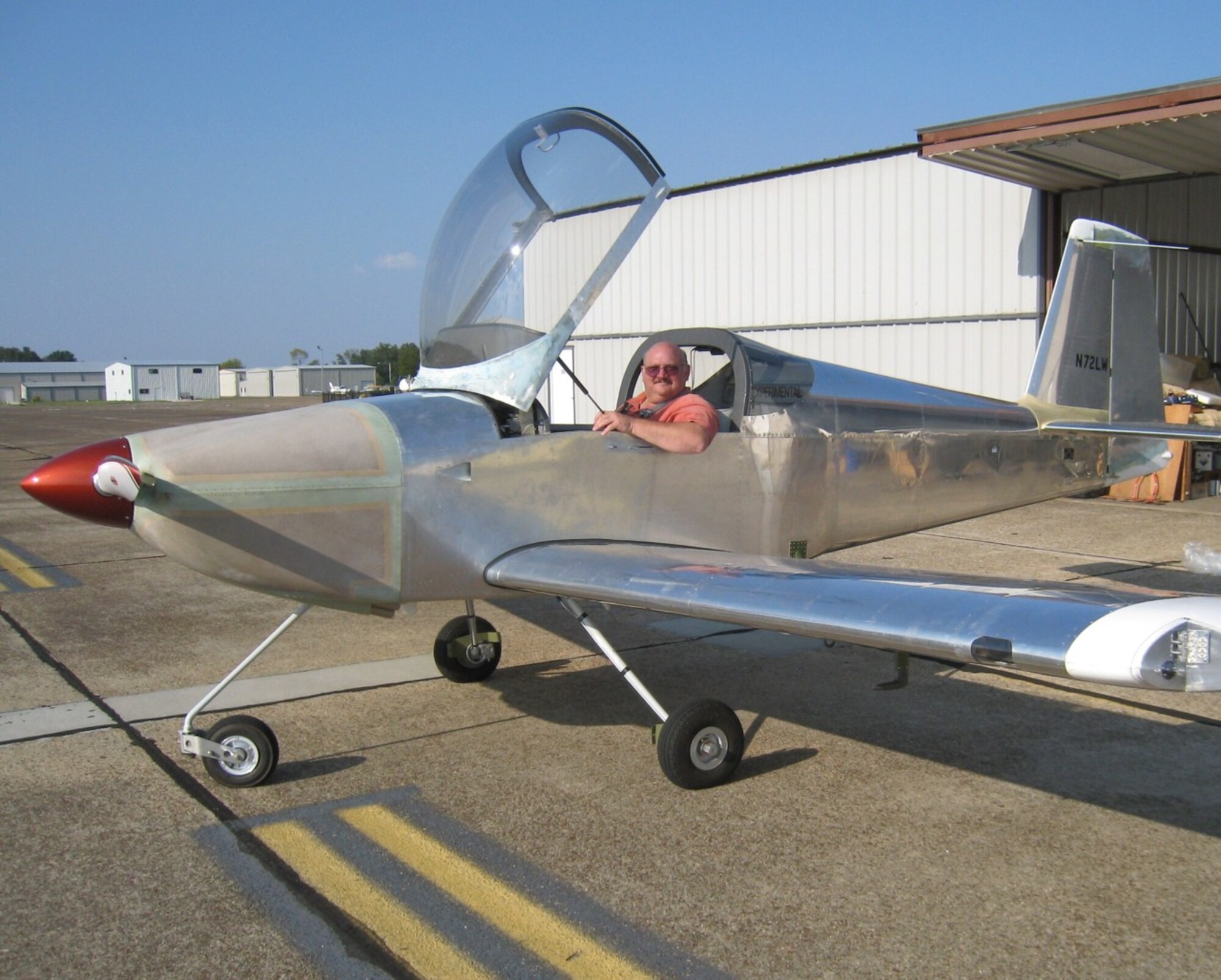 Larry Wilhite, section manager for ATA's control and data systems development branch, sits in the cockpit of his recently completed RV-7A aircraft he built from a kit purchased from Van's Aircraft Corp., based in Oregon. Wilhite is an electrical engineer who had literally taken his love of engineering home with him, installing the domestic version of Programmable Logic Controller units that control lighting, temperature and other environmental variables in his home. Five years ago, he decided to build his own aircraft, renew his private pilot's license and finally took to the sky with his home-built aircraft on Sept. 2. (Photo provided)