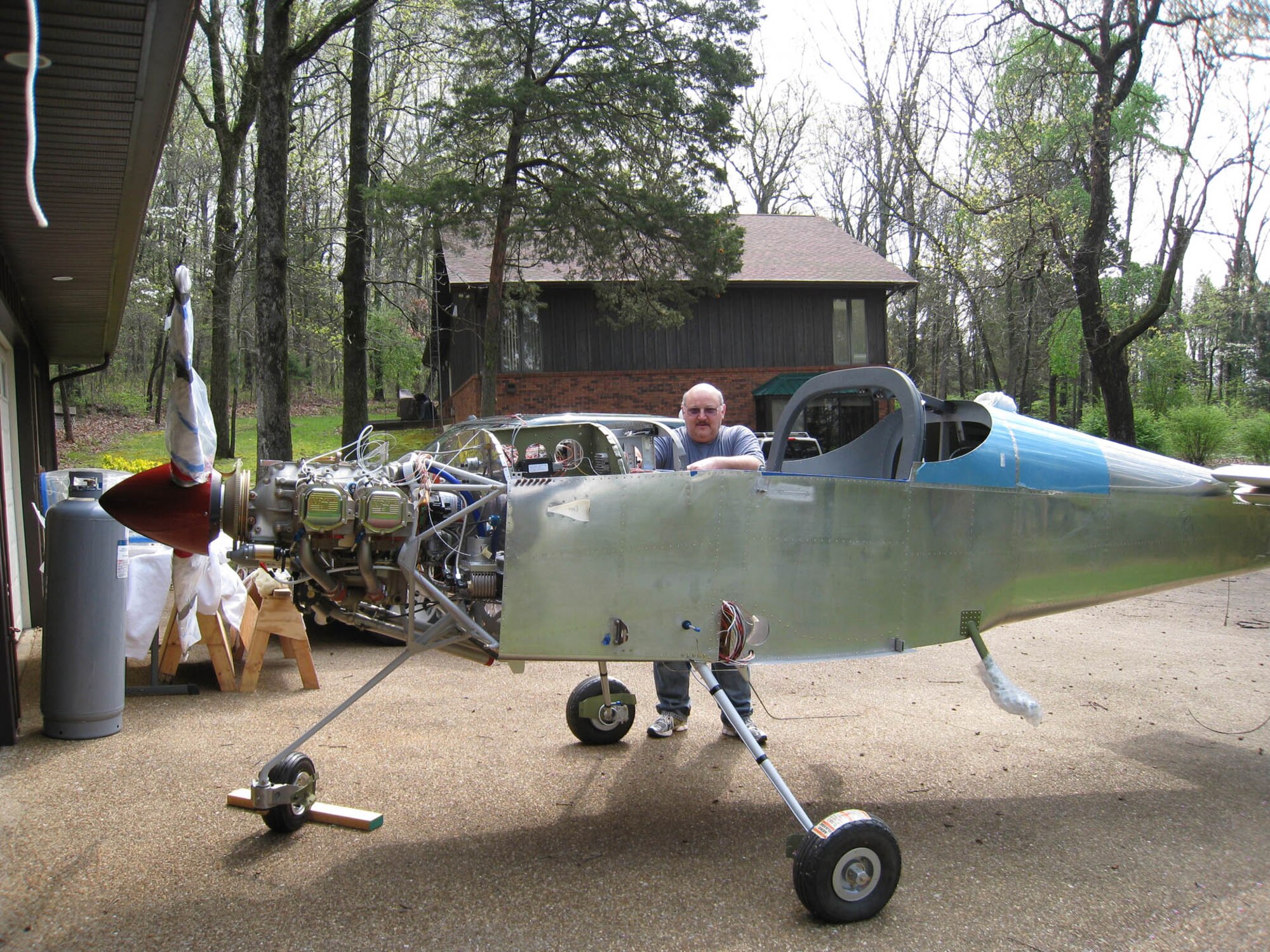 Larry Wilhite, an electrical engineer at AEDC, pauses for a photo alongside his project aircraft he was building a few years prior to his Sept. 2, 2010 maiden flight. (Photo provided)