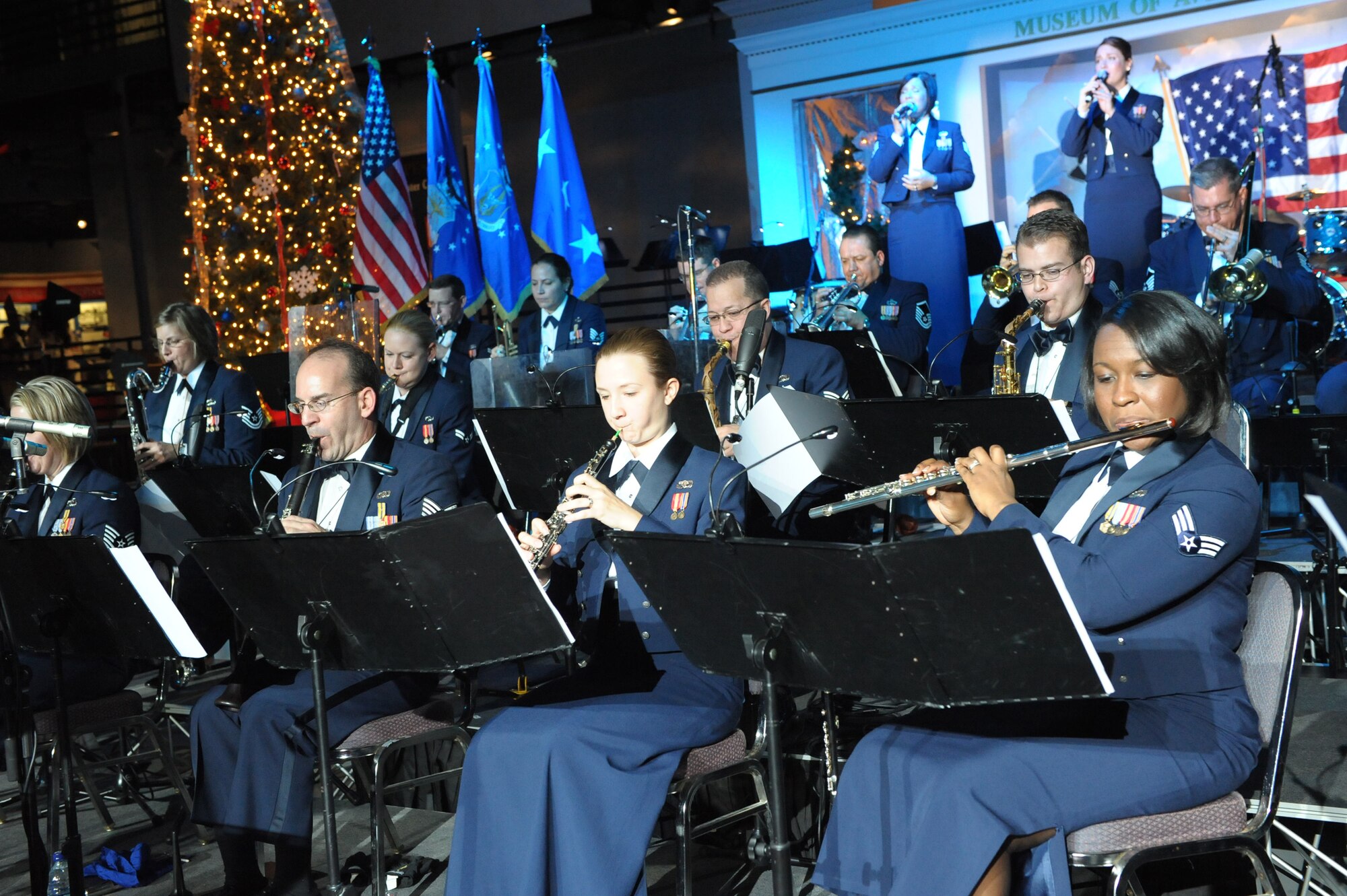 The Band of the U.S. Air Force Reserve performs during the Holiday Concert at the Museum of Aviation, Dec. 9, 2010. More than 800 Warner Robins community members gathered for the holiday event.  (U.S. Air Force photo/Raymond Crayton, Jr.)