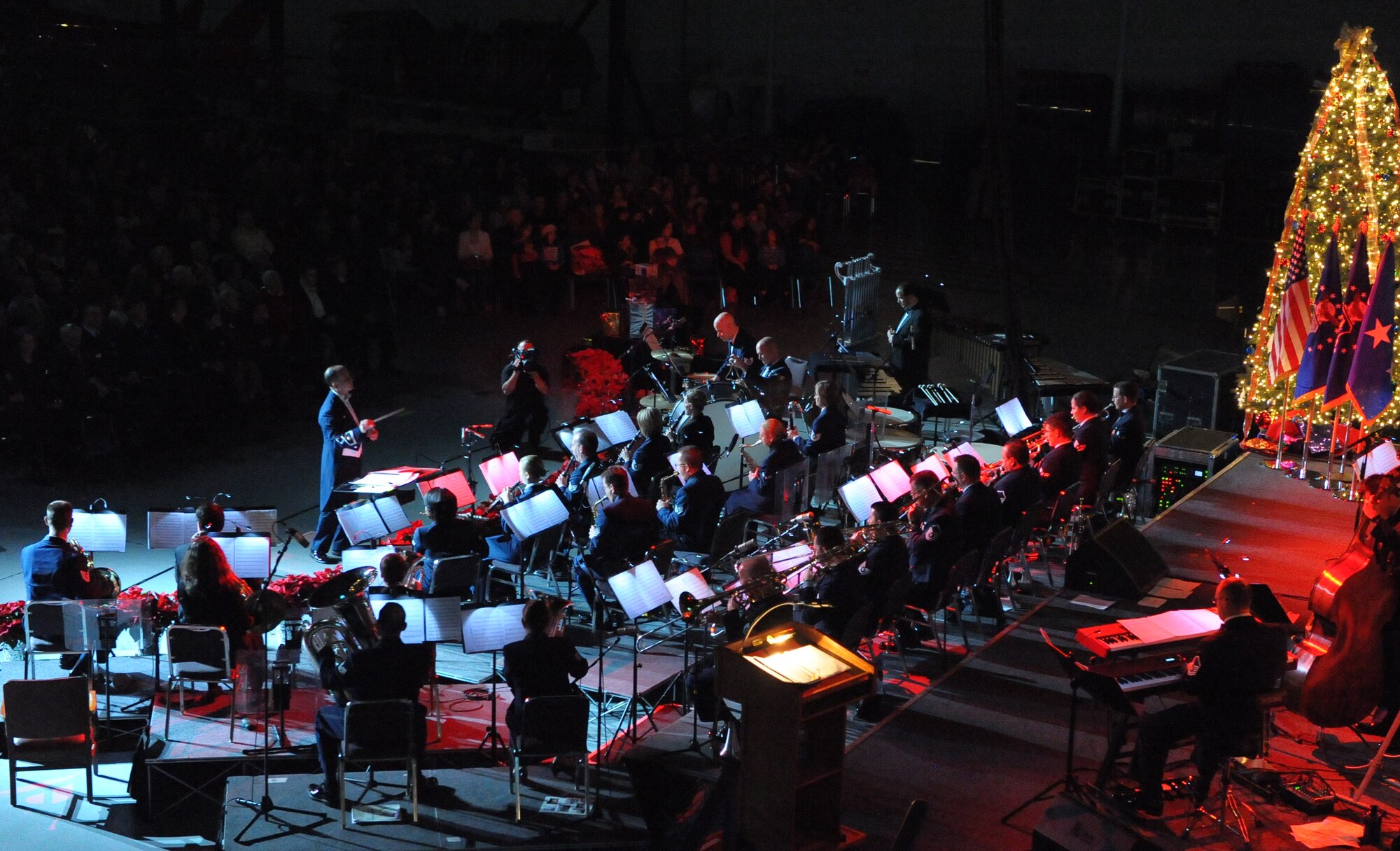 Maj. Donald Schofield conducts the Band of the U.S. Air Force Reserve during the Holiday Concert at the Museum of Aviation, Dec. 9, 2010. More than 800 Warner Robins community members gathered for the holiday event.  (U.S. Air Force photo/Raymond Crayton, Jr.)