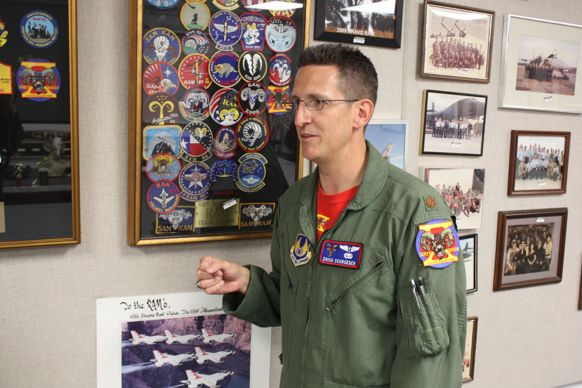 Maj. Erich Schroeder, 3rd Year Residency in Aerospace Medicine student speaks with a group about his experiences in the program; “Knowing what the warfighter needs and how to best support those needs are what the RAM helps us do.”   Maj Schroeder will graduate from the RAM program on June 30th, 2011 as part of the last graduating class from Brooks City-Base.  The USAF School of Aerospace Medicine is currently relocating to Wright-Patterson AFB.  Behind Maj Schroeder are many of the reminders of the long heritage of the RAM program. (Photo By: Amy Velasquez, USAFSAM/EDD)