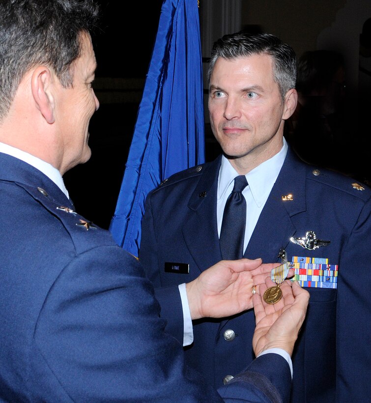 Maj. Gen. Frank Padilla presents the Airman's Medal to Lt. Col Richard L. Lowe at a ceremony Dec. 10, 2010, at Randolph Air Force Base, Texas. Colonel Lowe distinguished himself by heroism involving voluntary risk of life following the crash of Continental Airlines Flight 1404 Dec. 20, 2008, at Denver International Airport. General Padilla is the 10th Air Force commander at Air Force Reserve Command Joint Reserve Base at Fort Worth, Texas. Colonel Lowe is a 340th Reserve Flight instructor. (U.S. Air Force photo/Don Lindsey)