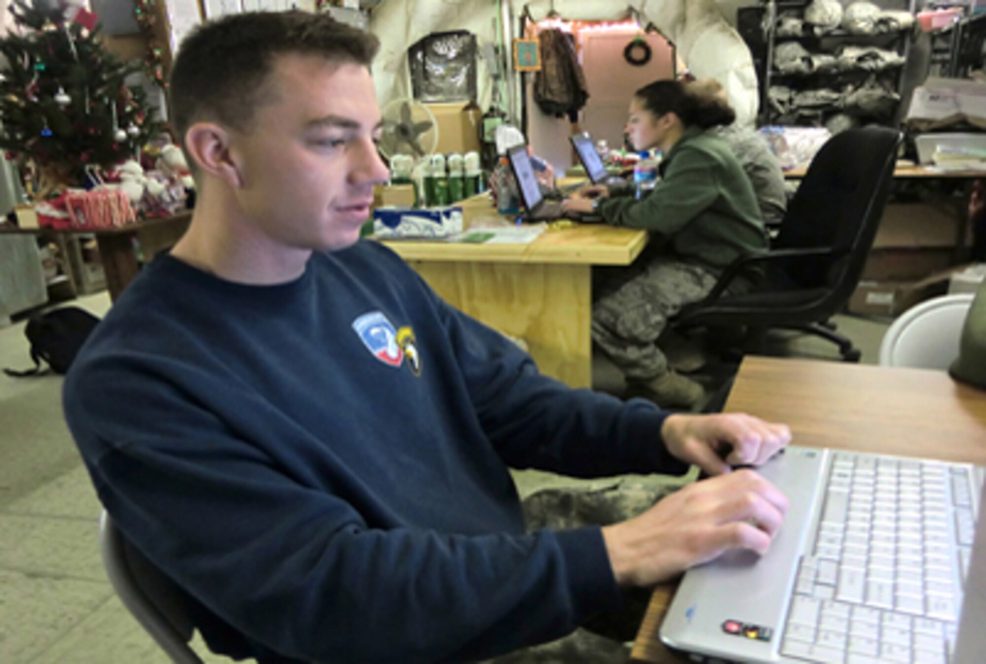 Army Staff Sgt. Kris Sapp uses a computer on the morale network Dec. 12, 2010, at the 455th Contingency Aeromedical Staging Facility at Bagram Airfield, Afghanistan. Sergeant Sapp is a 101st Airborne Division fire support specialist. He was wounded in Afghanistan's Ghazni province as the result of an improvised explosive device attack. (U.S. Air Force photo/Capt. Erick Saks)