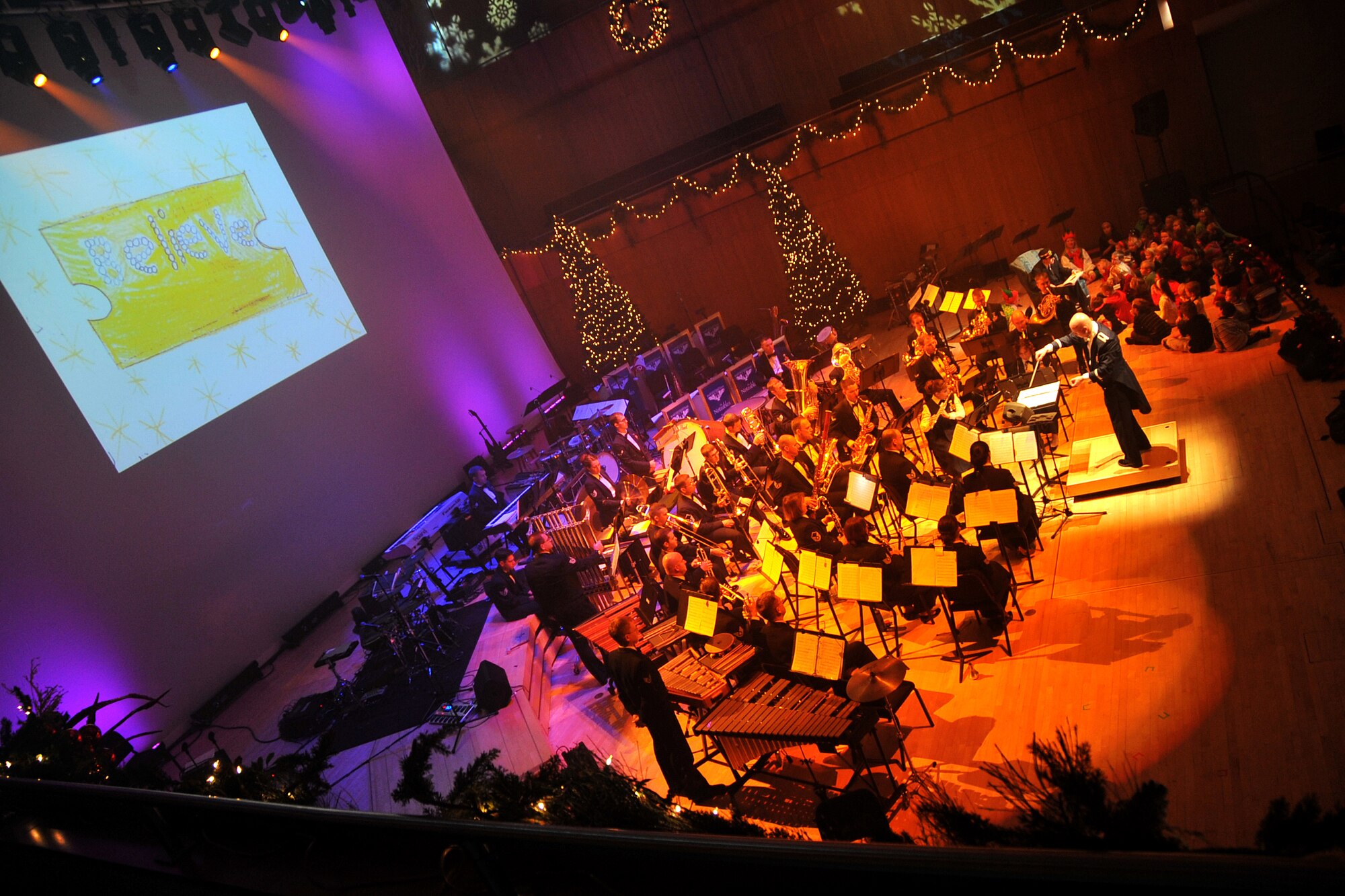 OFFUTT AIR FORCE BASE, Neb. - Children are invited on stage to listen to the story "The Polar Express" at the annual holiday concert hosted by the Holland Performing Arts Center. The annual holiday concert?s theme of ?Christmas in Reel Time? showed songs of the holidays through films of the past. U.S. Air Force Photo by Jeff W. Gates.