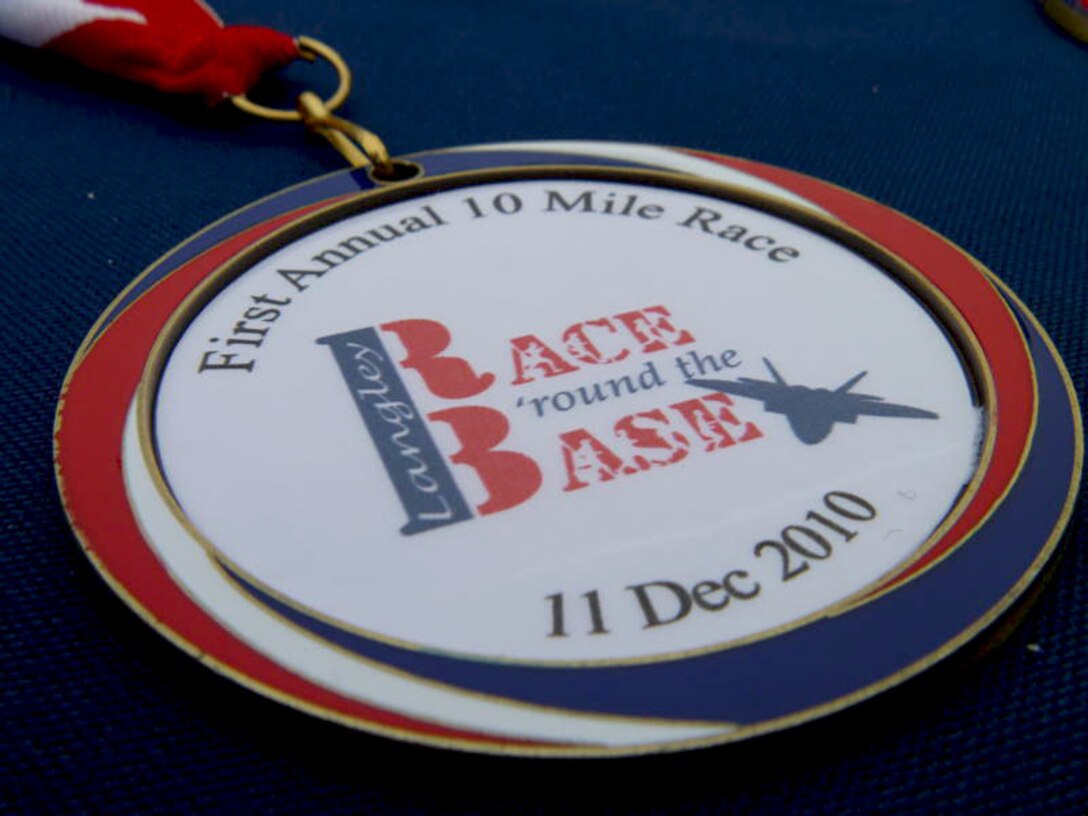 LANGLEY AIR FORCE BASE, Va. --A medal for the 10-mile portion of the Race 'Round the Base is displayed on a table Dec. 11. The 10-mile and 5K race event is the first ever held here, inspired by the esprit de corps of the Joint Base Langley-Eustis reunion. (U.S. Air Force photo/Tech. Sgt. Monique Jose-Duvall)(RELEASED)