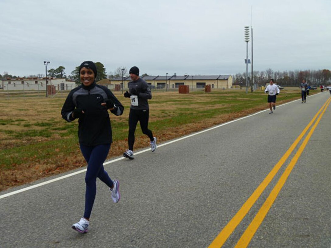 LANGLEY AIR FORCE BASE, Va. -- Force Support Squadron Commander, Lt. Col. Jenise Carroll, participates in the 10-mile portion of the Race 'Round the Base, Dec. 11. The 10-mile and 5K race event is the first ever held here, inspired by the esprit de corps of the Joint Base Langley-Eustis reunion. (U.S. Air Force photo/Tech. Sgt. Monique Jose-Duvall)RELEASED)