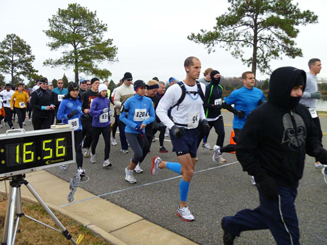 LANGLEY AIR FORCE BASE, Va. -- Runners participate in the 5K portion of the Race 'Round the Base Dec. 11. The 10-mile and 5K race event is the first ever held here, inspired by the esprit de corps of the Joint Base Langley-Eustis reunion. (U.S. Air Force photo/Tech. Sgt. Monique Jose-Duvall)(RELEASED)