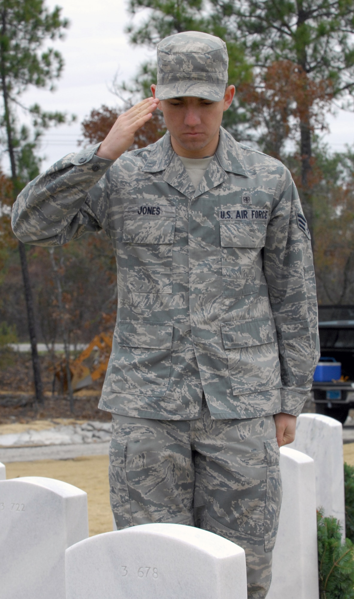 Senior Airman Adrian Jones salutes the tombstone of a fallen veteran at the Wreaths Across America ceremony Dec. 11, 2010, at Fort Jackson National Cemetery in Columbia, S.C. The ceremony included a memorial presentation, World War II wreath laying, recognition of prisoners of war, those still missing in action and Merchant Marines, a salute by a cannon battery and buglers. Airman Jones is a medical technician with the 20th Medical Operations Squadron. (U.S. Air Force photo/ Airman 1st Class Daniel Phelps) 