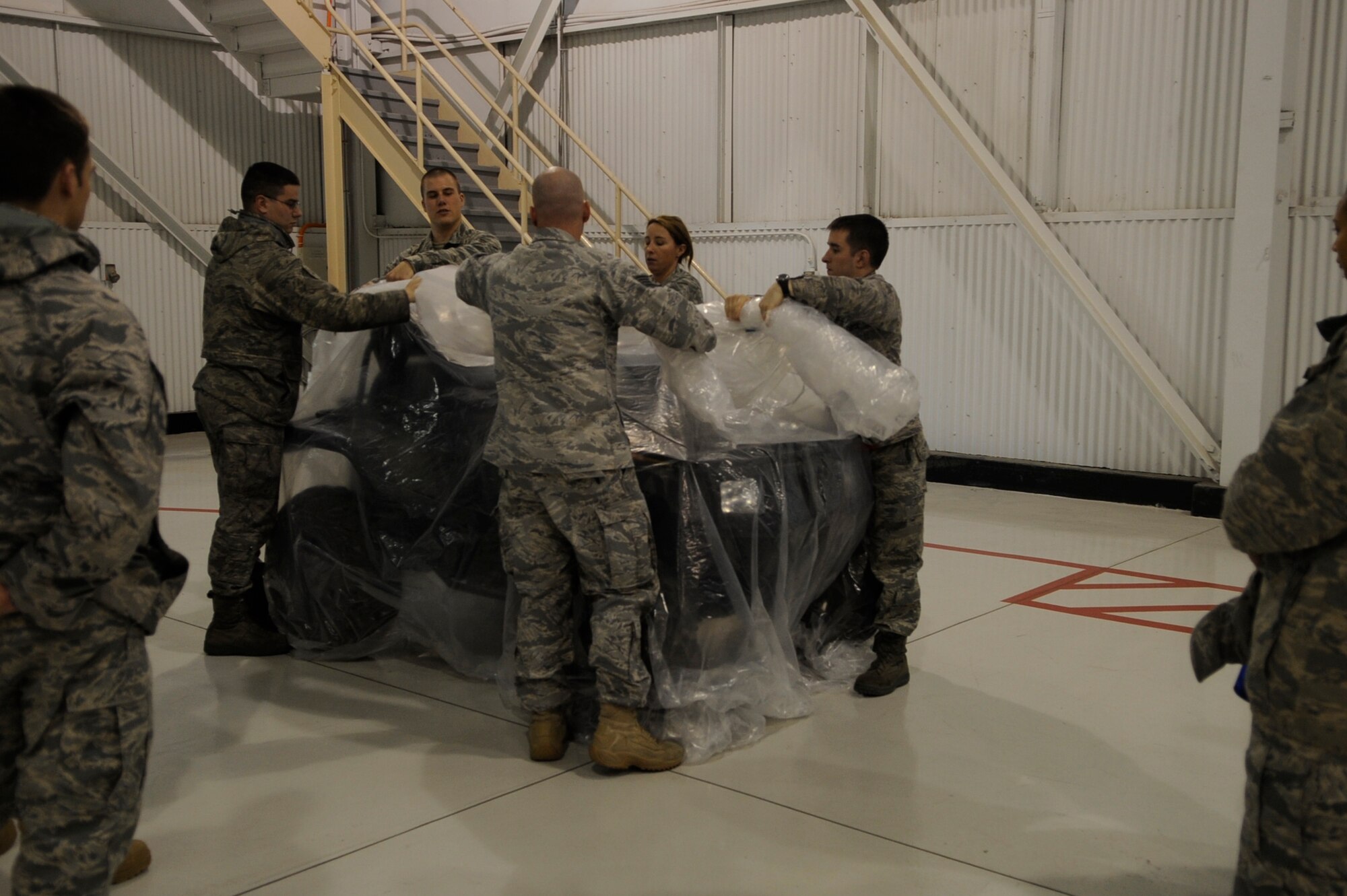 MOUNTAIN HOME AIR FORCE BASE, Idaho -- Airmen participate in simulated emergency situations during the Ability to Survive and Operate Rodeo Dec. 13 in Hangar 1331. The purpose of the ATSO Rodeo was to increase the critical real-world and Phase II ATSO skills through combined academic and practical stations. (U.S. Air force photo by Senior Airman Angelina Drake)