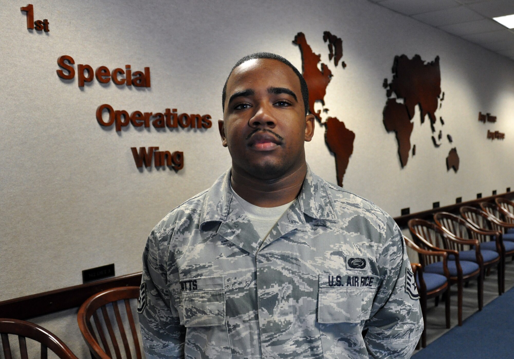 Staff Sgt. Rashid Watts, 1st Special Operations Wing BattleStaff, poses in a conference room at wing headquarters at Hurlburt Field, Fla., Dec. 14, 2010. Sergeant Watts was selected for this week's Tip of the Spear spotlight. (DoD photo by U.S. Air Force Airman 1st Class Joe McFadden / RELEASED)
