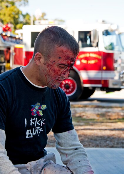 A victim waits for treatment at the on-scene triage after a simulated chlorine explosion  at Post'l Point Dec. 1 during the base's Chemical Biological Nuclear Explosive exercise.  The exercise tested Eglin's first responders such as security forces and fire department as well as the medical group's emergency technicians.  96th Medical Group Airmen set up a decontamination tent to process the victims through before providing detailed medical attention.   (U.S. Air Force photo/ Samuel King) 