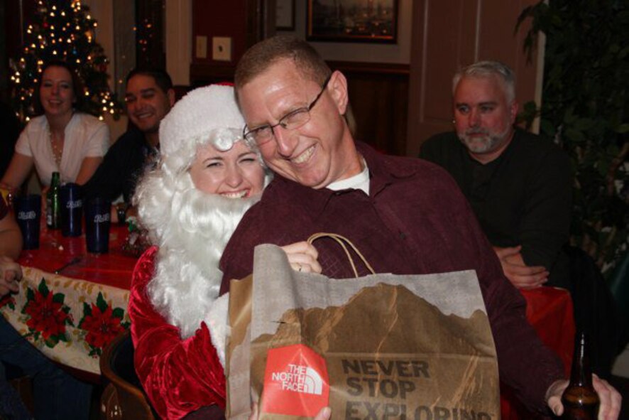 911th First Sergeant Angela Gibson spreads holiday cheer as Santa Claus during the squadron's annual Christmas party. We're still trying to determine if Master Sgt. Michael Rhudy (right) has been naughty or nice this year. (USAF photo courtesy of the 911ARS)