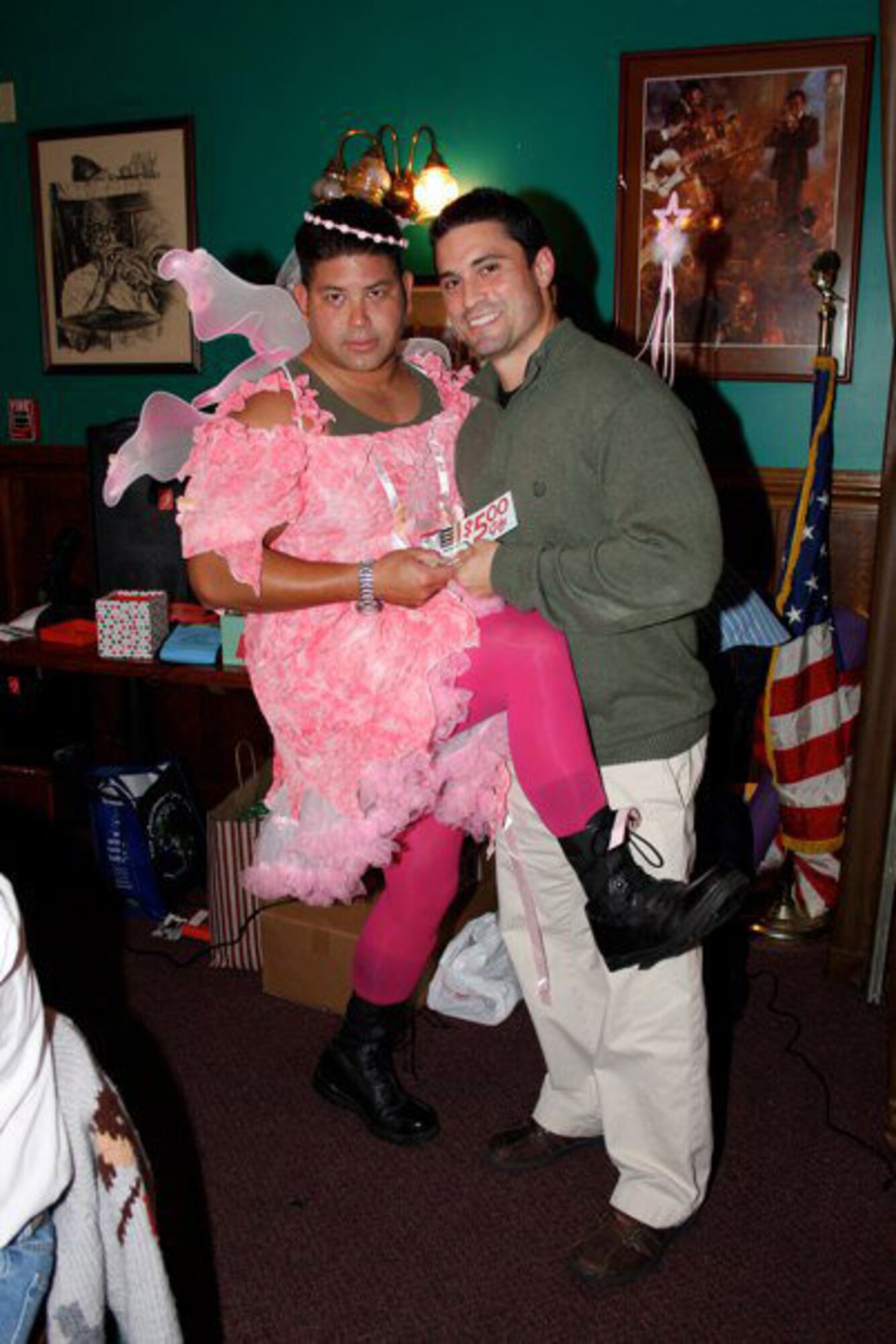 Master Sgt. John Ross (left) dressed as the Sugar Plum Fairy for the 911th's Christmas party. Capt. Nicholas Palumbo couldn't resist the photo op! Sgt. Ross garnered the most votes from fellow Airmen at the 911th to dress as the beloved holiday character. (USAF photo courtesy of the 911ARS)