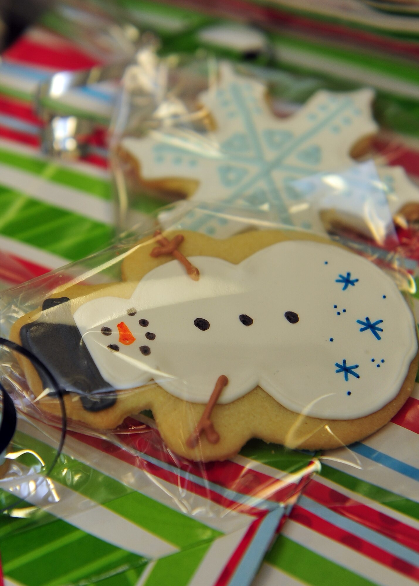 MINOT AIR FORCE BASE, N.D. -- Members of the Officer Spouses Club collect and package cookies for the annual cookie drive here Dec.9. Cookies were donated by base personnel as well as companies and families from Minot, N.D. These packages are given to Airmen residing in the dormitories as a way to spread holiday cheer. (U.S. Air Force photo/Senior Airman Michael J. Veloz)