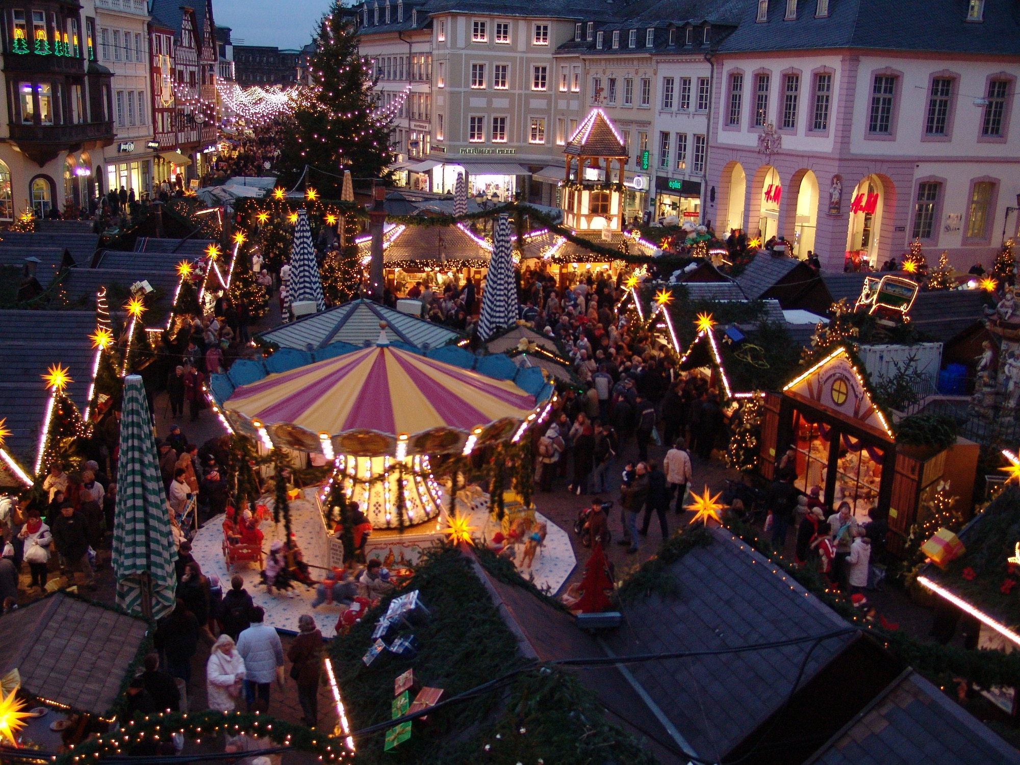 SPANGDAHLEM AIR BASE, Germany -- People shop and socialize at the traditional Trier Weihnachtsmarkt, open now until Dec. 22 in the main market square.  Opening times are 10:30 a.m. - 9 p.m. Monday - Wednesday, 10:30 a.m. - 9:30 p.m. Thursday - Saturday and 11:30 a.m. to 8:30 p.m. Sundays. Music and entertainment is scheduled throughout each weekend, and Santa will visit often. The United States Air Forces in Europe Band will perform Christmas music 6-7 p.m. Dec. 15 at the Trier market. Christmas markets take place everywhere in the country, starting mid-November and lasting until shortly before the holidays. (U.S. Air Force photo/Iris Reiff)