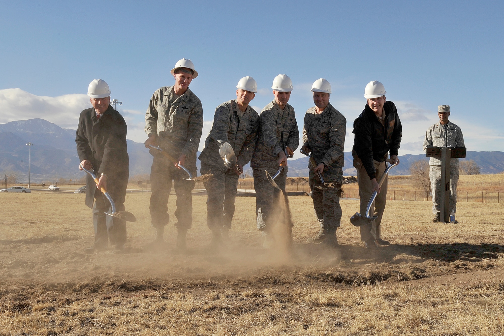 A groundbreaking was held Dec. 10 for the new Space Education and Training Center on Peterson Air Force Base. The $14.4 million facility will house the National Security Space Institute and Advanced Space Operations School. The center will be Air Force Space Command’s state-of-the-art training and education facility for space professionals. Breaking ground (left to right) are James Moschgat, associate dean of Operations, NSSI; Col. Roger Vincent, Space Innovation and Development Center commander; Maj. Gen. Michael Basla, AFSPC vice commander; Col. Stephen Whiting, 21st Space Wing commander; Col. Mark Hustedt, 310th Space Wing vice commander; and Navy Capt. Raymond Ginnetti, Navy Cyber Forces Colorado senior officer. (U.S. Air Force photo/Rob Bussard)