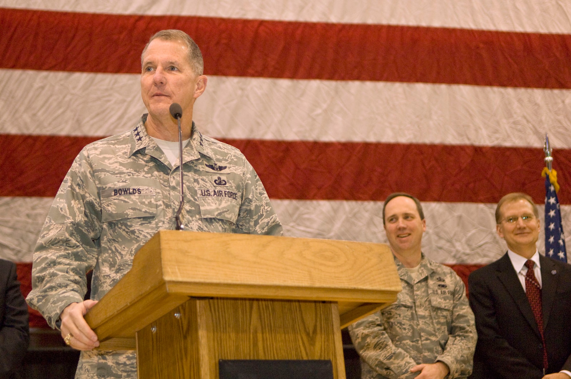 HANSCOM AIR FORCE BASE – Lt. Gen. Ted Bowlds, Electronic Systems Center commander, addresses the audience during Heroes Homecoming at the Aero Club Hangar on Dec. 10. More than 50 Hanscom personnel who have returned from deployments in the past six months and their families were honored during this pep rally-style event. (U.S. Air Force photo by Mark Wyatt)