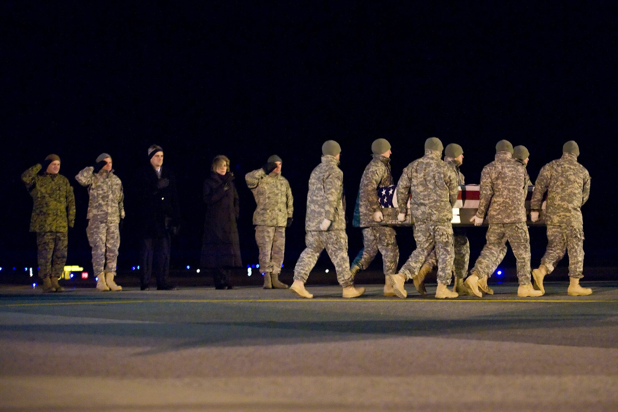 A U.S. Army carry team transfers the remains of Army Sgt. Willie A. McLawhorn Jr., of Conway, N.C., at Dover Air Force Base, Del., Dec. 13, 2010. McLawhorn was assigned to the 2nd Battalion, 502nd Infantry Regiment, 2nd Brigade Combat Team, 101st Airborne Division (Air Assault),Fort Campbell, Ky.(U.S. Air Force photo/Roland Balik)