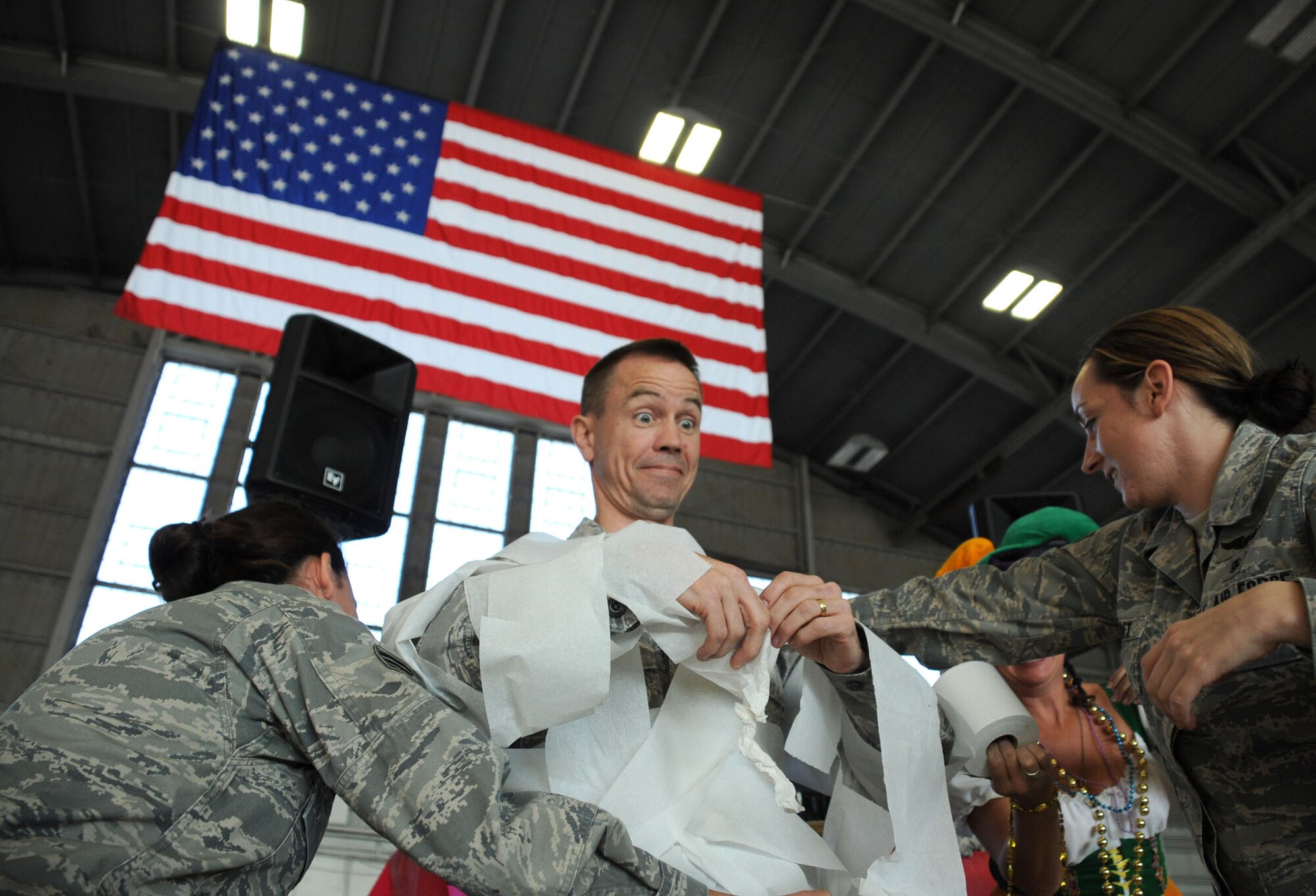 MacDill Air Force Base, Fla. -- As part of the holiday celebration, members of the 927th Air Refueling Wing made snowmen.  When no snow was available in Tampa, toilet paper sufficed. Maj. Kenneth Leonard, the 927th Maintenance Squadron commander, found himself looking like Frosty the Snowman by the end of the event. (Official United States Air Force photo by Staff Sgt. Shawn C. Rhodes)