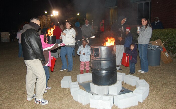 It was a cold night at the Joint Base Charleston-Weapons Station Holiday Festival, Dec. 8, but a bonfire for roasting marshmallows kept party-goers warm. (Photo courtesy David Holt)