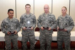 Diamond Sharp winners for December are left to right: Airman 1st class Lakan P. Ello, 628th Force Support Squadron, A1C Tyler J. Wehrung, 628th Communications Squadron, Senior Airman Michael A. Leon, Detachment 3, Navy Brig., and Staff Sgt. Jennifer L. Pentecost, 628th Security Forces Squadron. (U.S. Air Force photo/Staff Sgt. Marie Brown)