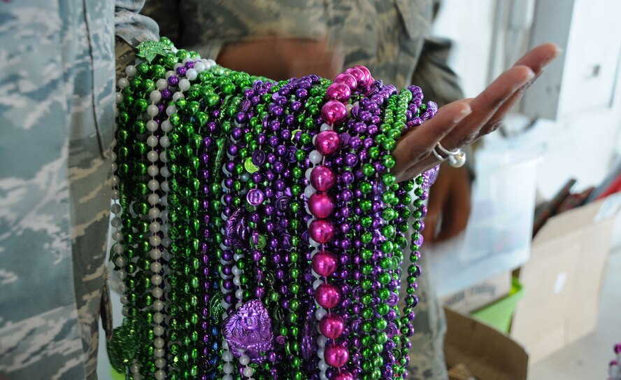 MacDill Air Force Base, Fla. -- The servicemembers and families of the 927th Air Refueling Wing gathered together Dec. 4 to celebrate Christmas.  The theme this year was 'Mardi Gras.' Beads and masks were a common sight at the party.  (Official United States Air Force photo by Staff Sgt. Shawn C. Rhodes)